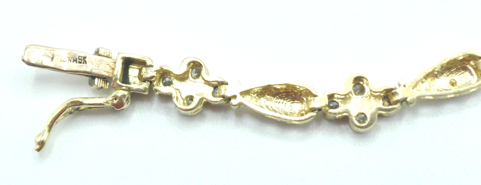 STAMPED 10K GOLD AND DIAMOND BRACELET. - Image 8 of 8