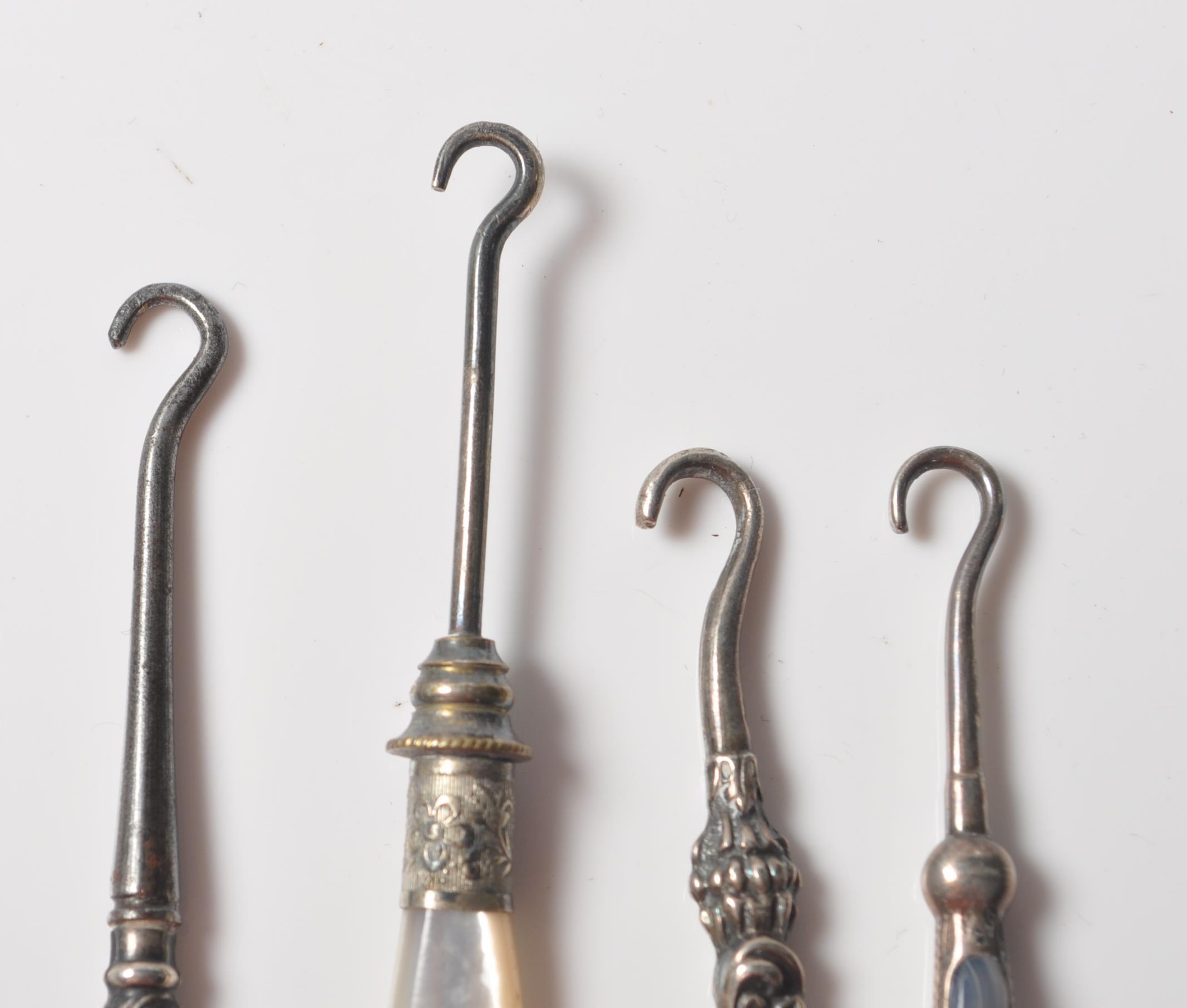 COLLECTION OF FOUR VICTORIAN SILVER BUTTON HOOKS WITH AGATE AND MOTHER OF PEARL HANDLES. - Image 5 of 8