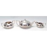 20TH CENTURY THREE PIECES SILVER PLATED TEA SERVICE