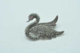 STAMPED 925 SILVER LADIES SWAN BROOCH SET WITH MARCASITES.