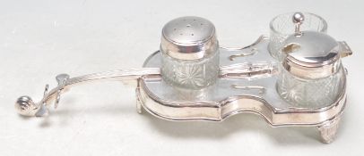 SILVER PLATED CONDIMENT CRUET SET IN THE FORM OF A CELLO.