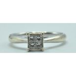 STAMPED 9CT WHITE GOLD AND DIAMOND RING.