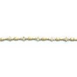 STAMPED 10K GOLD AND DIAMOND BRACELET.