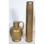 1957 NAVY BRASS SHELL AND A HAND CRAFTED JUG