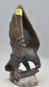 20TH CENTURY CARVED HARDSTONE FIGURE OF A BIRD OF PREY.