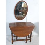 1940’S OAK DROP LEAF DINING TABLE AND OVAL WALL MIRROR