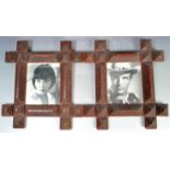 MATCHING PAIR OF VICTORIAN TRAMP ART CARVED PHOTO FRAMES