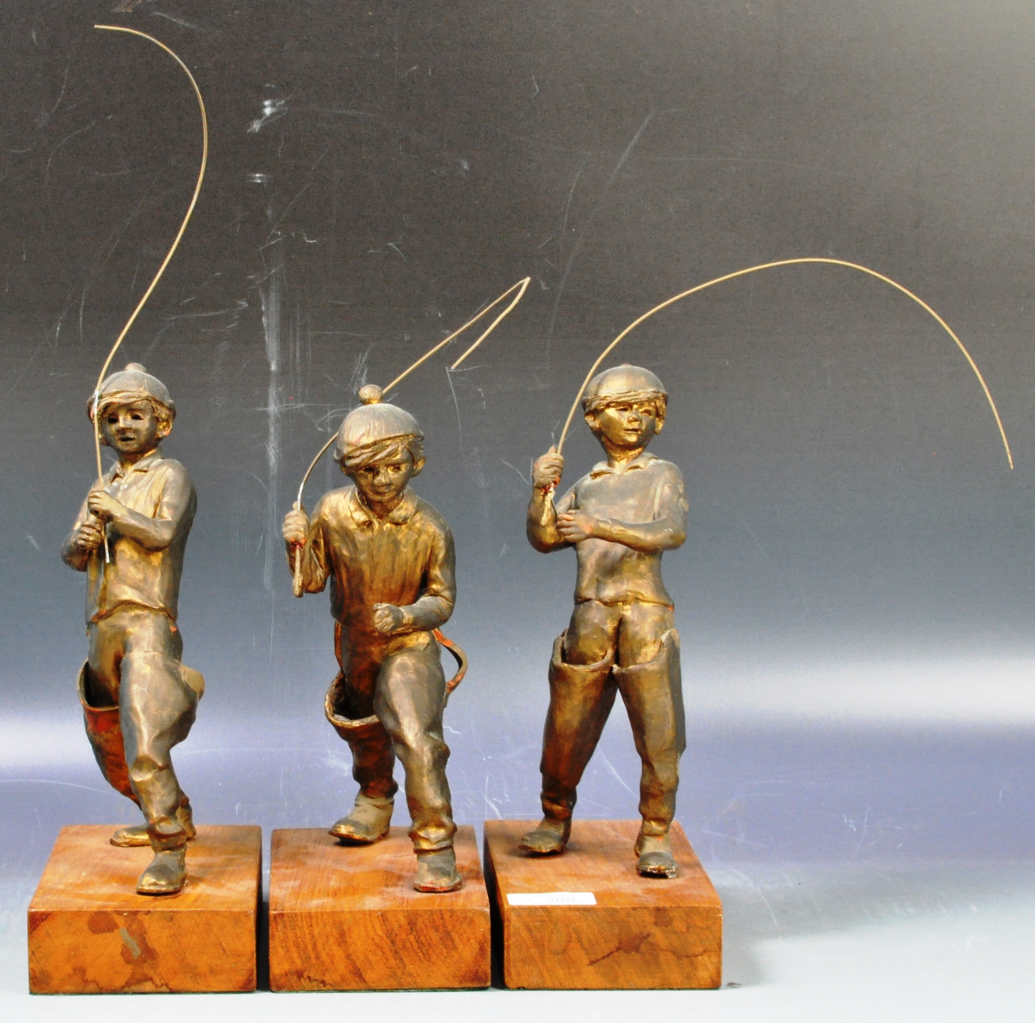 SET OF THREE BRITISH SCHOOL BRONZE EFFECT FISHING BOY FIGURES