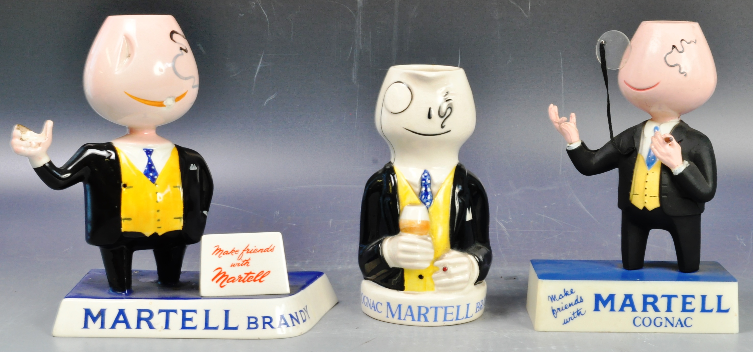 COLLECTION OF MARTELL COGNAC ADVERTISING FIGURES