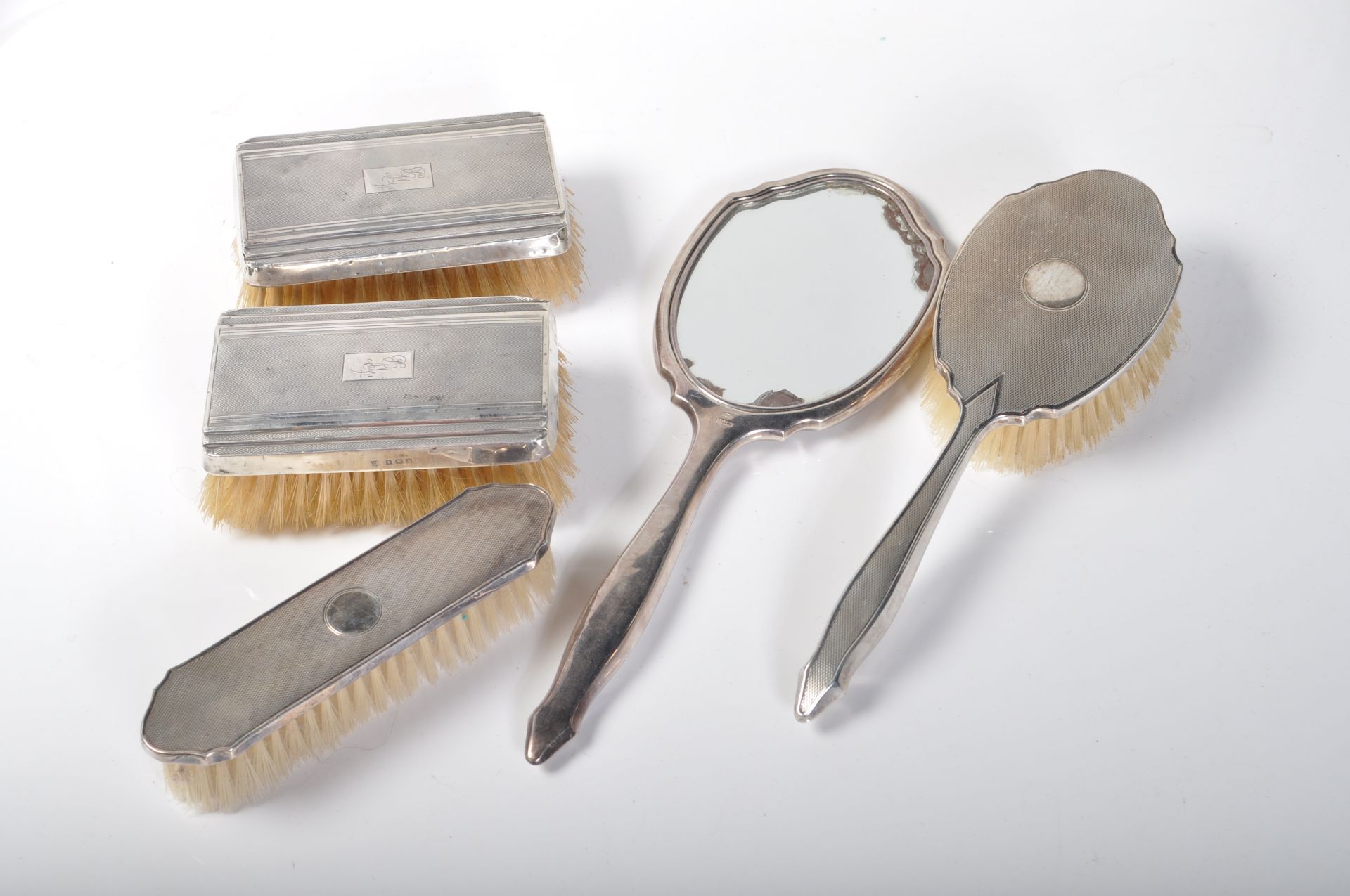 20TH CENTURY SILVER DRESSING TABLE BRUSH SET.