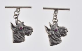 PAIR OF STAMPED STERLING SILVER DOG CUFFLINKS.