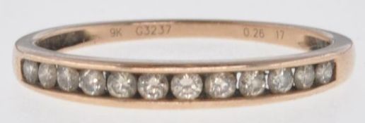 STAMPED 9CT GOLD AND DIAMOND ETERNITY RING.