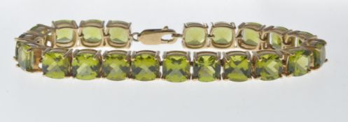 9CT GOLD AND PERIDOT LINE BRACELET