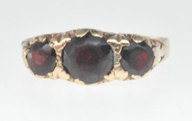 9CT GOLD AND THREE RED STONE RING