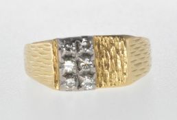 18CT GOLD RING SET WITH SIX DIAMONDS.