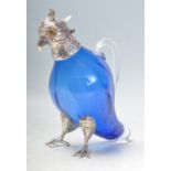 SILVER PLATE AND BLUE GLASS PARROT CLARET JUG.