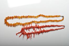 VINTAGE CORAL BRANCH NECKLACE AND AMBER BEAD NECKLACE.