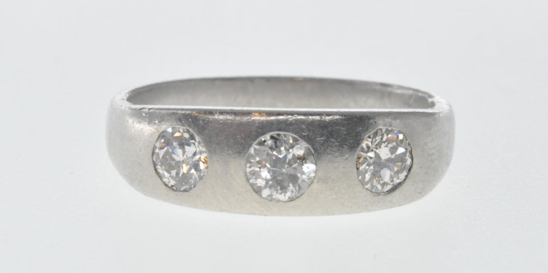 PLATINUM AND DIAMOND THREE STONE GYPSY RING