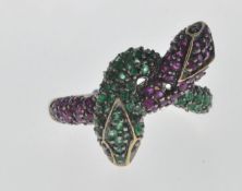 STAMPED 9CT GOLD SNAKE RING SET WITH PINK AND GREEN STONES.