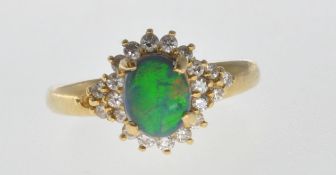 18CT GOLD BLACK OPAL AND DIAMOND RING