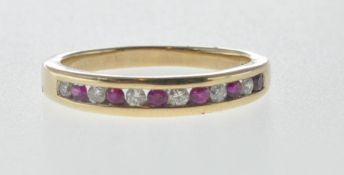 9CT GOLD HALF ETERNITY RING SET WITH WHITE AND RED STONES