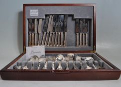 VINTAGE 20TH CENTURY EIGHT PERSON CANTEEN OF STAINLESS STEEL CUTLERY