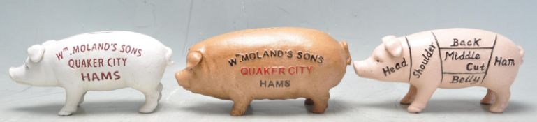 COLLECTION OF THREE CAST IRON PIG BANKS