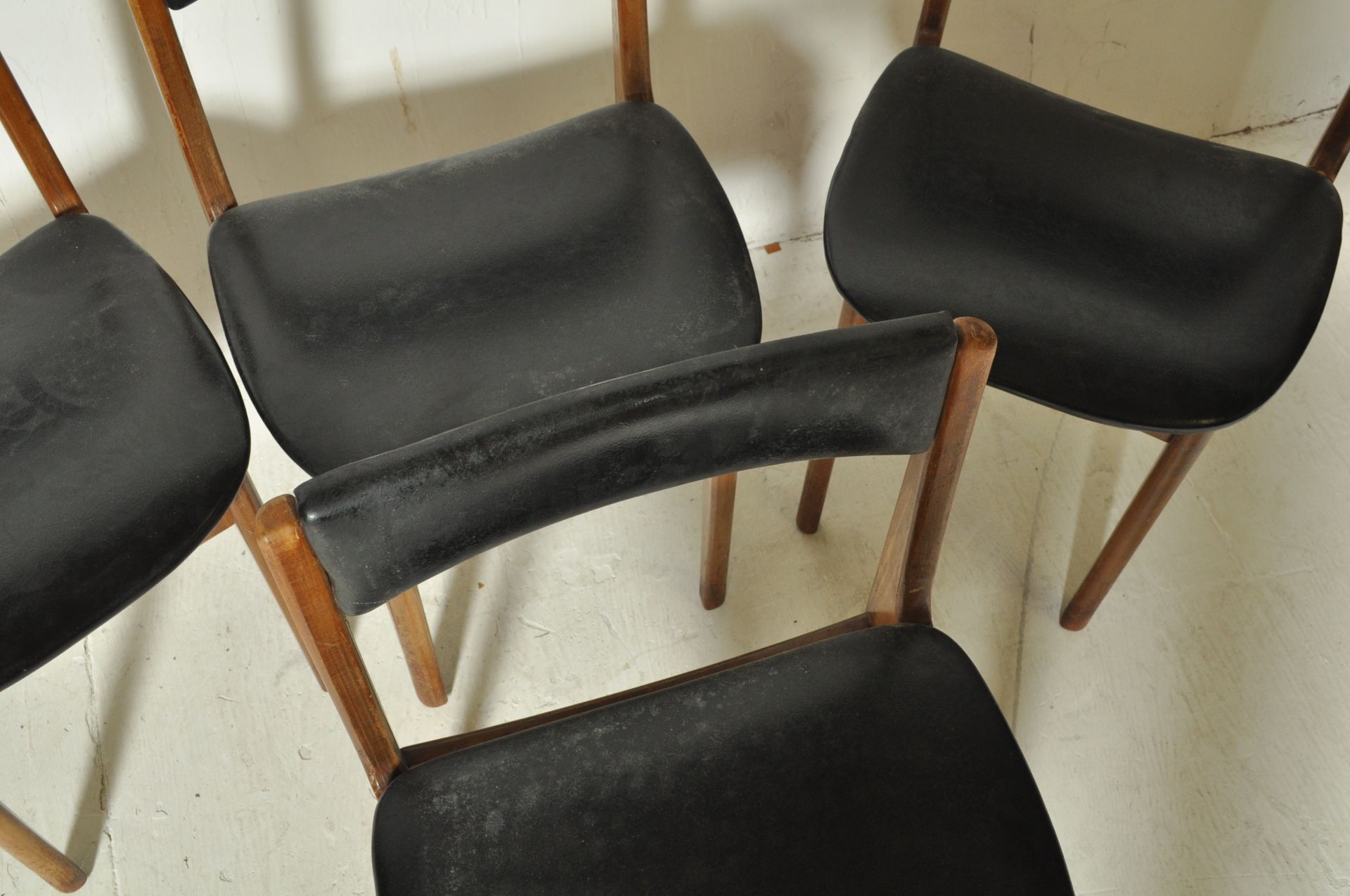 FOUR DANISH INSPIRED TEAK WOOD AND BLACK VINYL DINING CHAIRS - Image 4 of 6