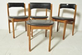 FOUR DANISH INSPIRED TEAK WOOD AND BLACK VINYL DINING CHAIRS