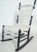 EARLY 20TH CENTURY WHITE AND BACK PAINTED WICKER ROCKING CHAIR