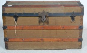 1930’S WOOD, METAL AND CANVAS SHIPPING TRUNK