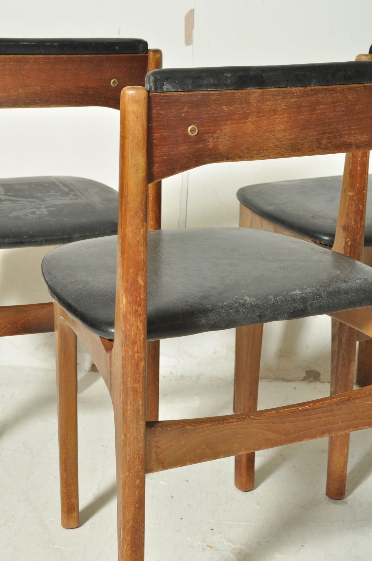 FOUR DANISH INSPIRED TEAK WOOD AND BLACK VINYL DINING CHAIRS - Image 6 of 6