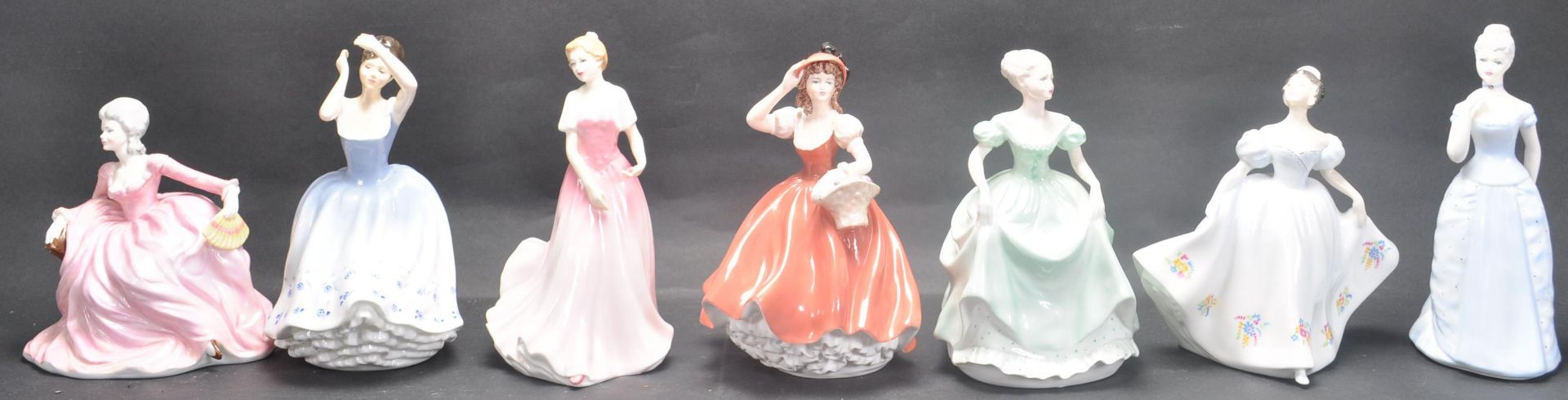 GROUP OF SEVEN CERAMIC PORCELAIN LADIES FIGURINES