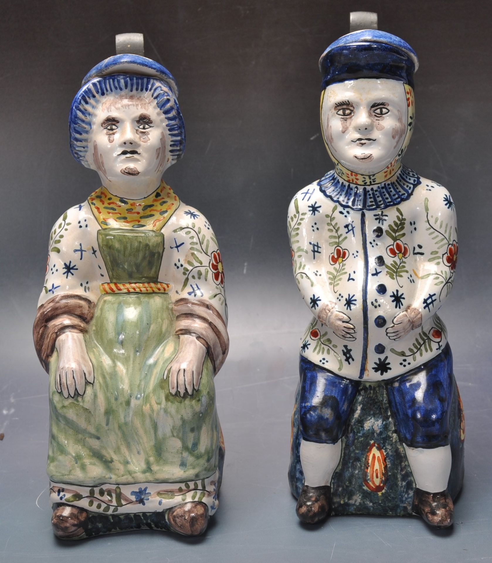 PAIR OF 20TH CENTURY QUIMPER FIGURAL JUGS.