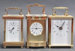 GROUP OF THREE BRASS CASED CARRIAGE CLOCKS.