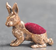 20TH CENTURY BRASS PIN CUSHION IN THE FORM OF A HARE.