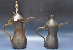 TWO MIDDLE EASTERN COPPER AND BRASS DALLAH TEAPOTS / COFFEE POT