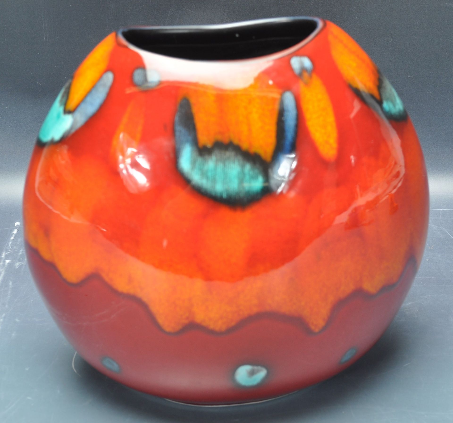 20TH CENTURY POOLE POTTERY VOLCANO PURSE VASE.