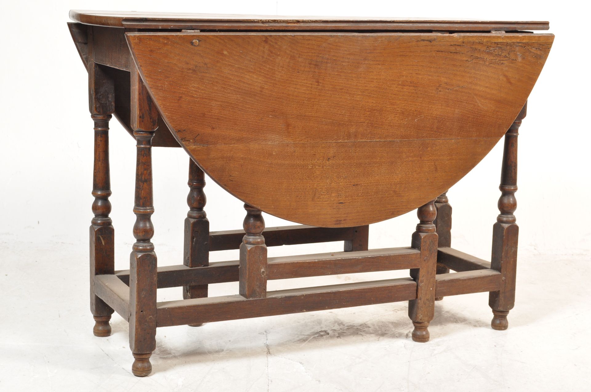 1930S OAK OVAL GATE LEG TABLE.