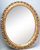 CONTEMPORARY GILT WALL MIRROR OF OVAL FORM