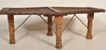 20TH CENTURY CHINESE OX CART COFFEE TABLE.