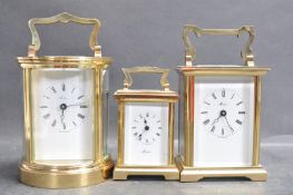 THREE 20TH CENTURY MISTAS HENLEY BRASS CARRIAGE CLOCKS.