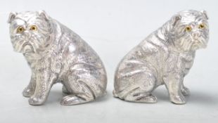 PAIR OF SILVER PLATED SALT AND PEPPER CRUET SET IN THE FORM OF BULLDOGS.