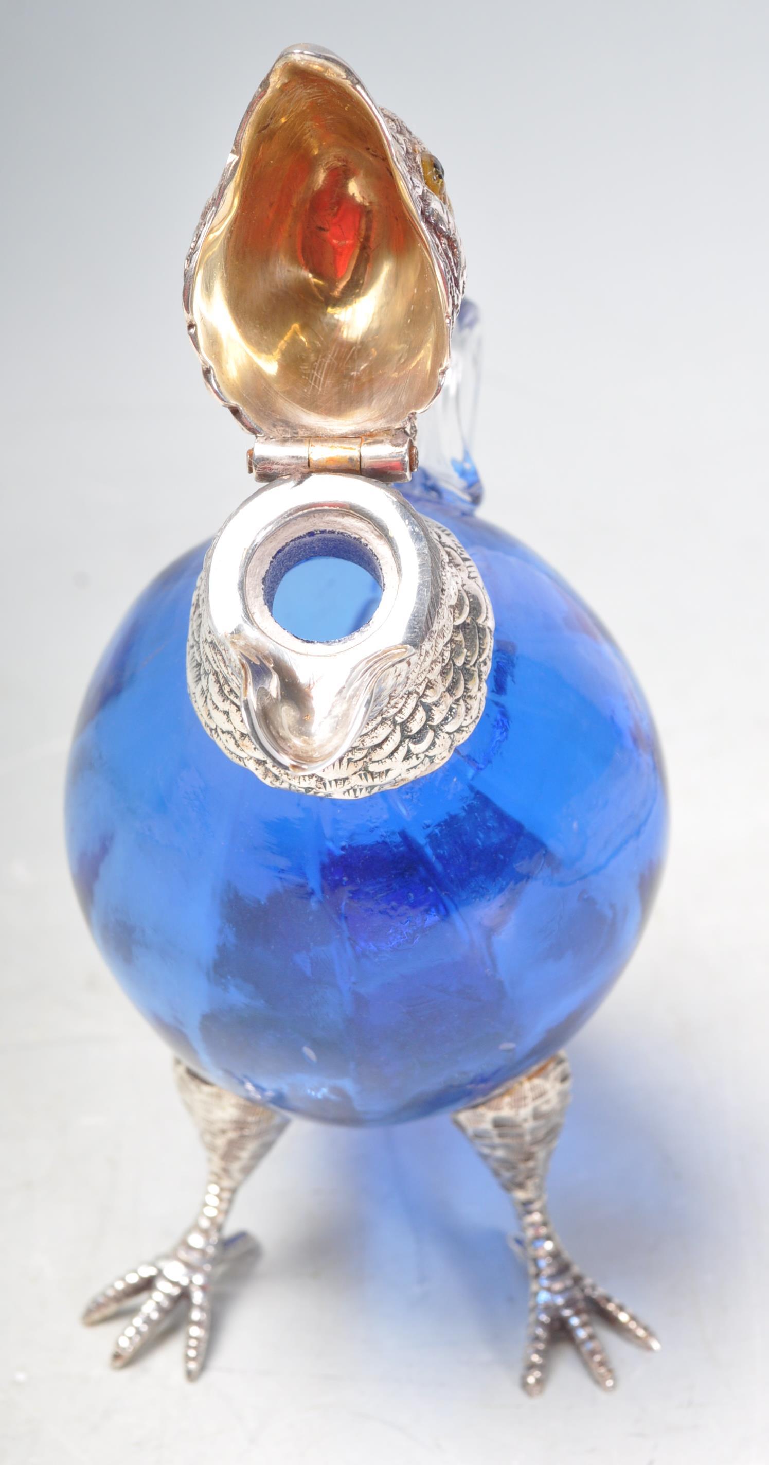 SILVER PLATE AND BLUE GLASS PARROT CLARET JUG. - Image 7 of 7