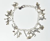 LADIES WHITE METAL CHARM BRACELET.