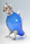 SILVER PLATE AND BLUE GLASS PARROT CLARET JUG.