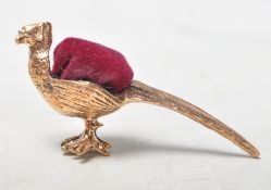 ANTIQUE STYLE BRASS PIN CUSHION IN THE FORM OF A PHEASANT.