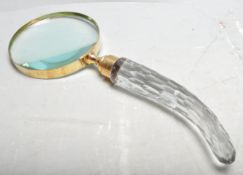 LARGE HANDHELD MAGNIFYING GLASS.