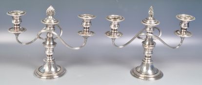 PAIR OF 20TH CENTURY SILVER PLATED CANDELABRA CANDLESTICKS.
