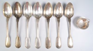 SILVER TEA STRAINER AND SEVEN TABLE SPOONS BY CHRISTOFLE